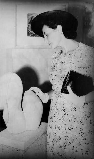 Viennese art critic Dr. Gertrude Langer inspecting a local art show, Brisbane, 1940